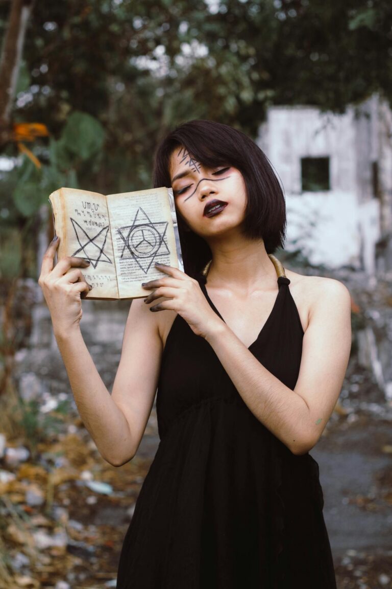A woman stands outdoors holding an open book with occult symbols, exuding a mystical and eerie vibe.